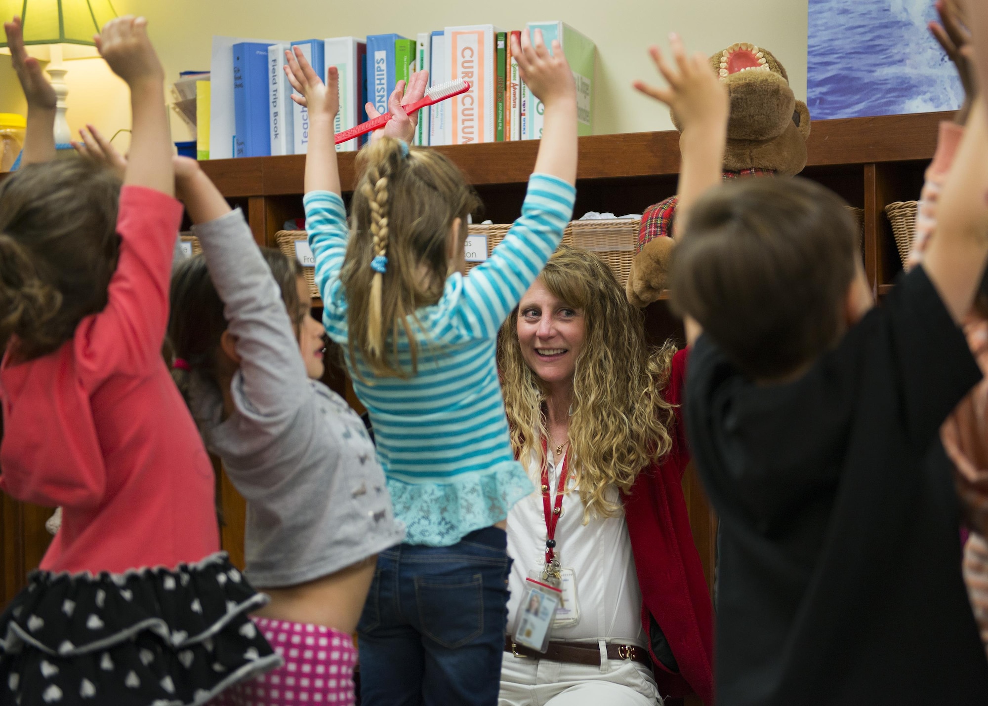 Monica Dunn leads children at Child Development Center II through a presentation on dental hygiene on Feb. 10, 2017. (US Air Force photo/Sara Francis)