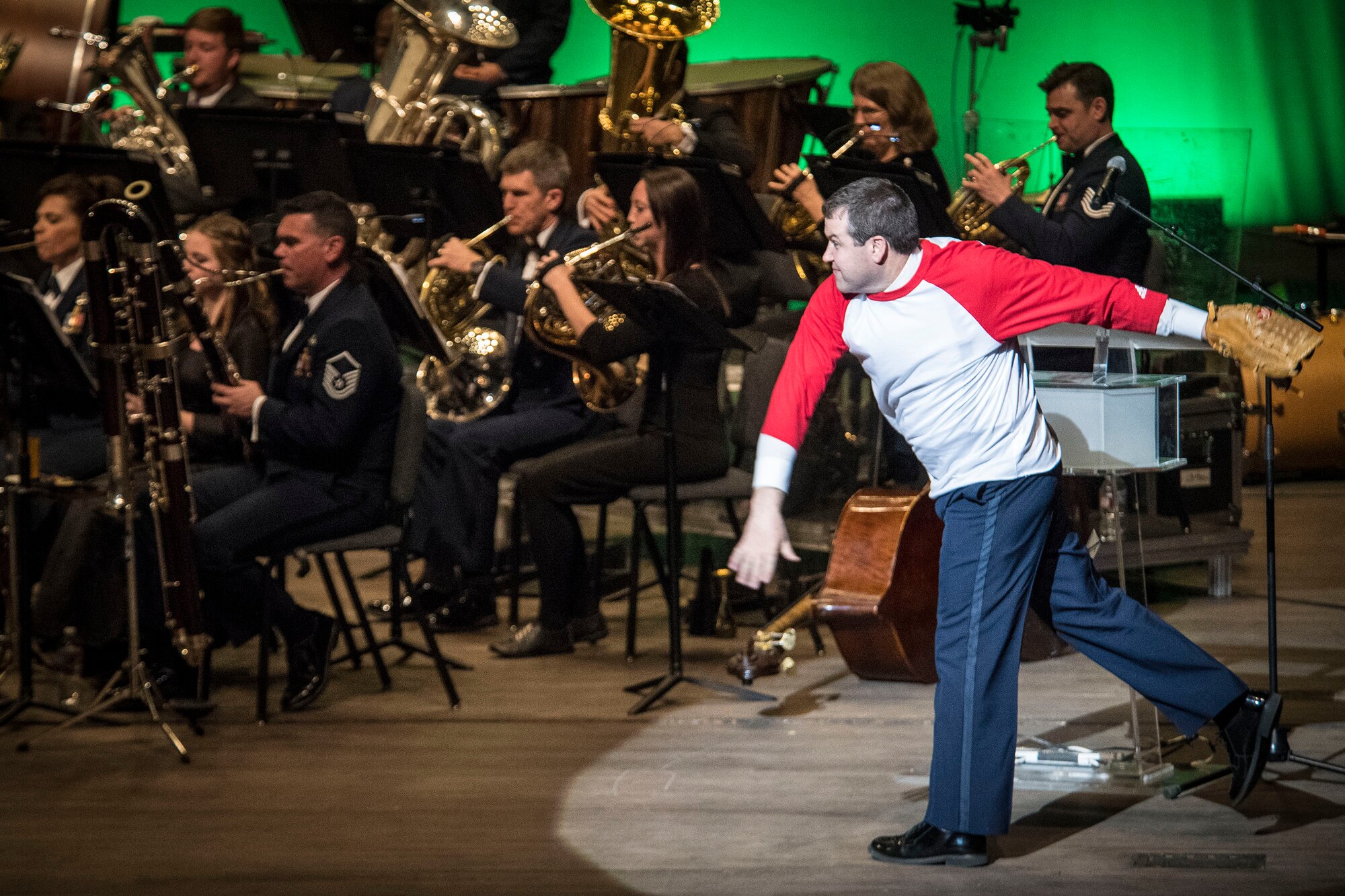 A U.S. Air Force Academy Band member plays the role of a pitcher during a musical performance of ‘The National Game’ Feb. 13 at Weber State University’s Austad Auditorium. (U.S. Air Force photo)