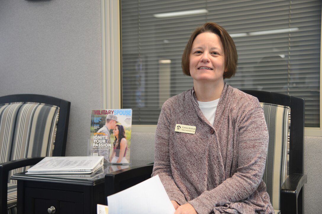 Carmen Kubiak, 341st Force Support Squadron Airman and Family Readiness Center employment program manager, sits in the lobby at the A&FRC, Feb. 14, 2017, at Malmstrom Air Force Base, Mont. Kubiak is reaching out to Malmstrom spouses to share all of the educational and employment opportunities. (U.S. Air Force photo/ Staff Sgt. Delia Marchick)