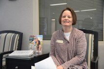 Carmen Kubiak, 341st Force Support Squadron Airman and Family Readiness Center employment program manager, sits in the lobby at the A&FRC, Feb. 14, 2017, at Malmstrom Air Force Base, Mont. Kubiak is reaching out to Malmstrom spouses to share all of the educational and employment opportunities. (U.S. Air Force photo/ Staff Sgt. Delia Marchick)
