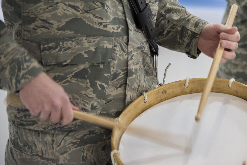 U.S. Air Force Band percussionist beats on a drum during the Chief Master Sergeant of the Air Force Transition Ceremony rehearsal at Joint Base Andrews, Md., Feb. 16, 2017. The Band, U.S. Air Force Honor Guard and base members are scheduled to attend the ceremony, February 17. (U.S. Air Force photo by Airman 1st Class Valentina Lopez)