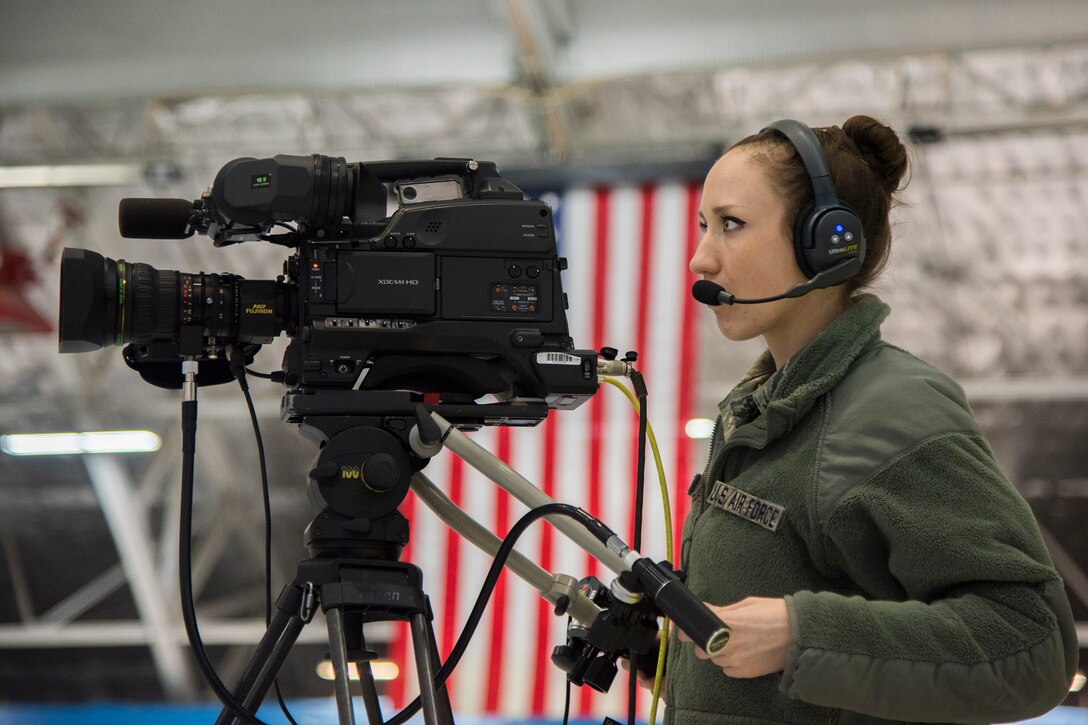 Staff Sgt. Elisa Juhas, U.S. Air Force TV broadcast producer, documents the Chief Master Sergeant of the Air Force Transition Ceremony rehearsal at Joint Base Andrews, Md., Feb. 16, 2017. Chief Master Sergeant of the Air Force James A. Cody is scheduled to retire, February 17, after serving 32 years in the Air Force and the 18th Chief Master Sergeant of the Air Force Kaleth O. Wright is planned to be appointed. (U.S. Air Force photo by Airman 1st Class Valentina Lopez)