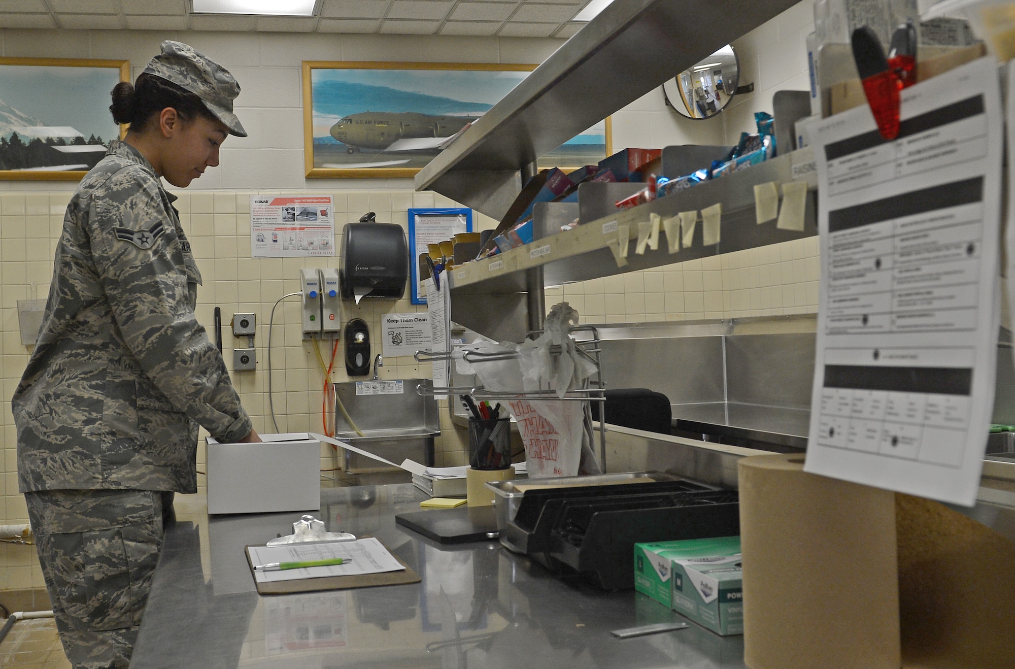 Airman 1st Class Arlena Harges, 627th Force Support Squadron food services apprentice, prepares a box meal in the McChord flight kitchen Feb. 14, 2017 at Joint Base Lewis-McChord, Wash. The flight kitchen prepares boxed meals that are available to flight crews, dorm residents, active duty members paying cash, and Department of Defense employees who would not be able to attend the Olympic Dining Facility during regular hours of operation. (U.S. Air Force photo/Senior Airman Divine Cox)