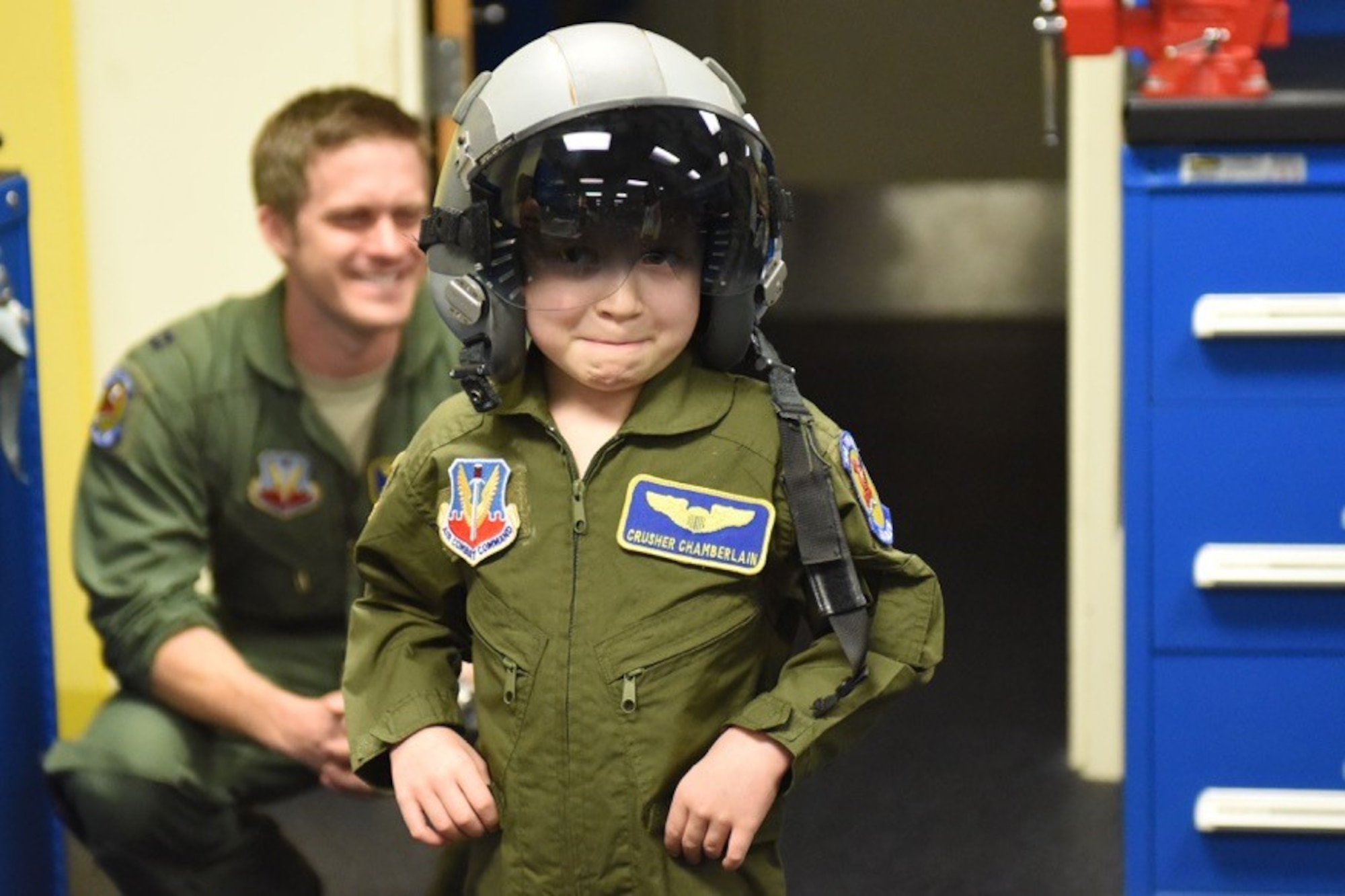 Alexis “Crusher” Chamberlain tries on her helmet and flight suit during a Pilot for a Day program event, Feb. 15, 2017, at Seymour Johnson Air Force Base, North Carolina. This event provides children with serious or chronic medical conditions, and their families with the opportunity to be a guest of the 4th Fighter Wing. (U.S. Air Force photo by Airman Miranda A. Loera)