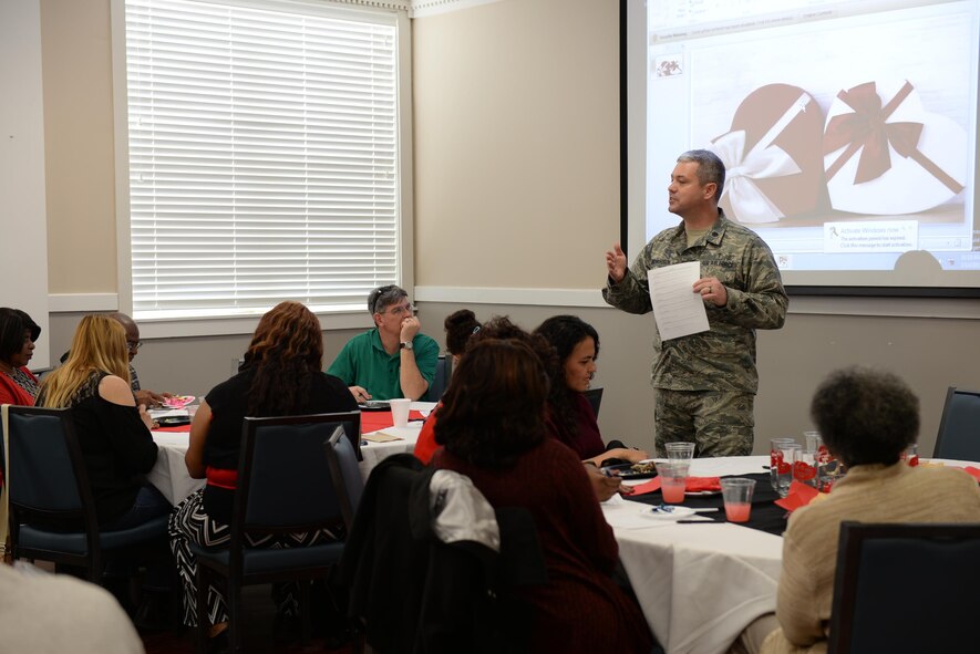 Chaplain (Lt. Col.) Steven Richardson, 14th Flying Training Wing, explains a relationship exercise Feb. 14, 2017, at the St. Valentine’s Day Lunch on Columbus Air Force Base, Mississippi. The lunch event included free food, a short comedy skit and a group relationship exercise. (U.S. Air Force photo by Senior Airman John Day)