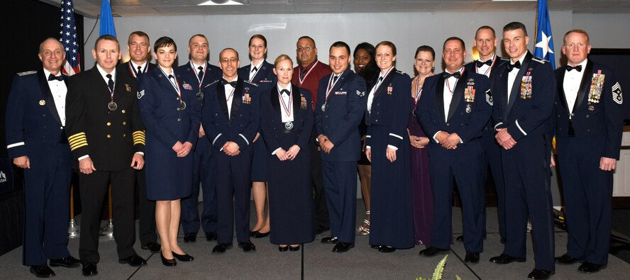 Maj. Gen. Garrett Harencak, Commander, Air Force Recruiting Service, Joint Base San Antonio-Randolph, Texas, joins Team BLAZE leadership and the 2016 Annual Award Winners for a group photo during the Annual Awards Banquet Feb. 9, 2017, at the Columbus Club on Columbus Air Force Base, Mississippi. During his visit, Harencak spent time thanking the nominees for doing all they do for the mission, the civic leaders for the amazing support they give to Columbus AFB and to the spouses for the sacrifices they make. (U.S. Air Force photo by Melissa Doublin)