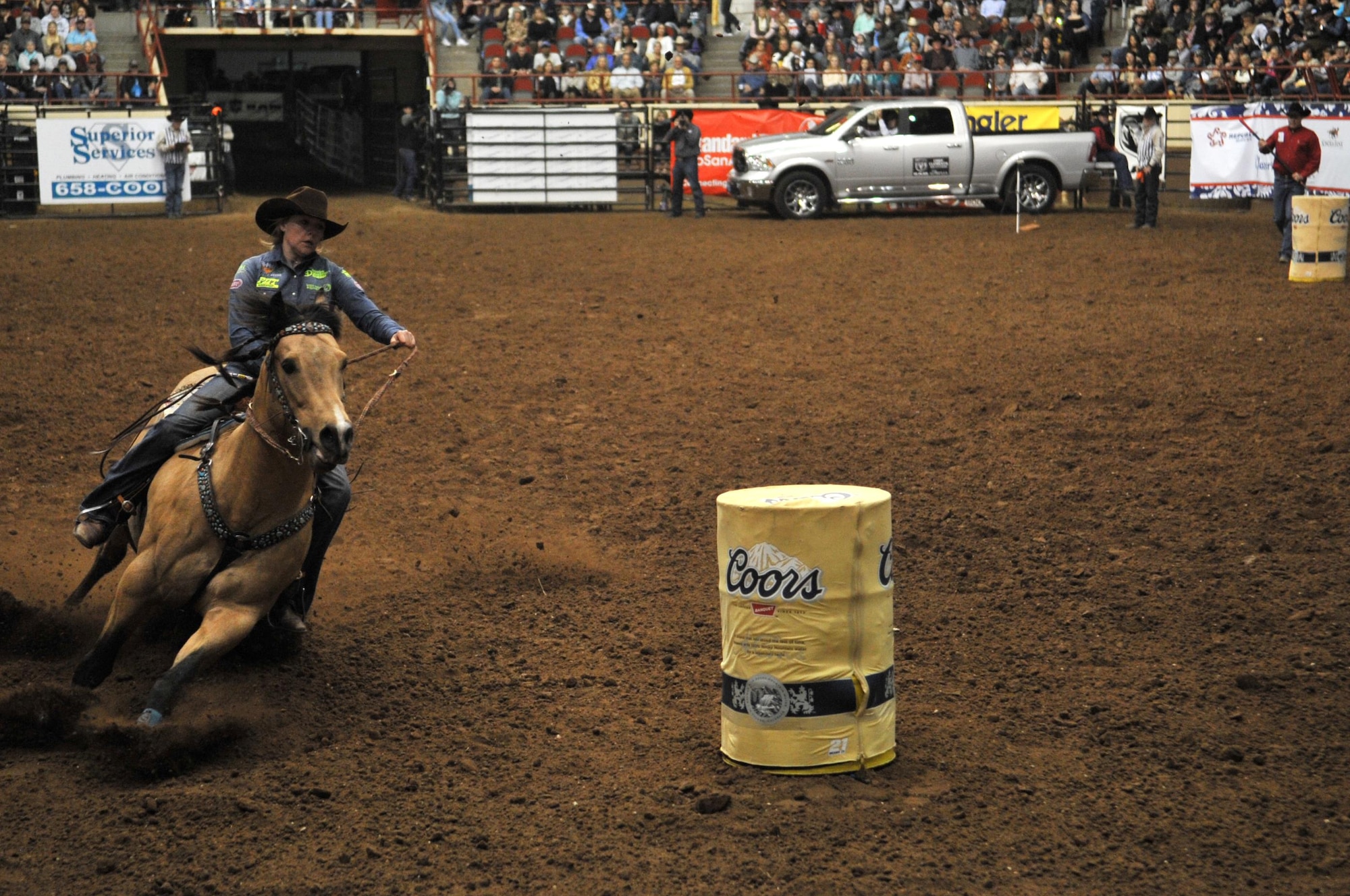 Jackie Ganter, San Angelo Stock Show and Rodeo barrel racing competitor, goes around for the last barrel during the 85th Annual San Angelo Stock Show and Rodeo Military Appreciation Night at the Foster Communications Coliseum in San Angelo, Texas, Feb. 15, 2017. Besides barrel racing, the rodeo featured calf roping and bareback horse riding. (U.S. Air Force photo by Staff Sgt. Laura R. McFarlane/Released)