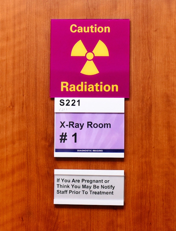 A sign warns patients of potential radiation dangers at the 341st Medical Support Squadron radiology clinic Feb. 15, 2017, at Malmstrom Air Force Base, Mont. Patients exposed to harmful levels of radiation can possibly have hazardous side effects including cancer, altering a person’s DNA and birthing children born with physical defects. (U.S. Air Force photo/Senior Airman Jaeda Tookes)