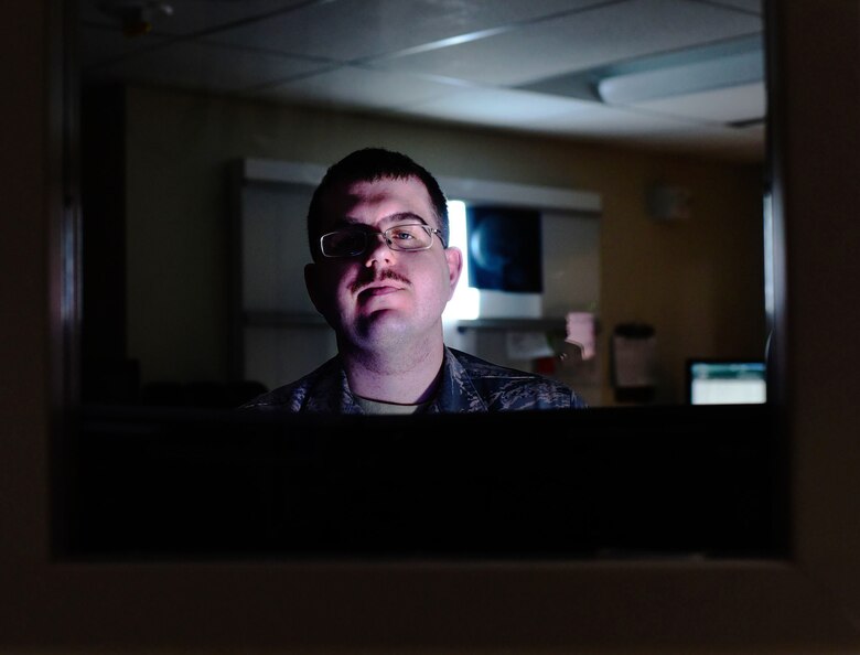 Staff Sgt. Jason Spearow, 341st Medical Support Squadron NCO in charge of diagnostic imaging, administers an x-ray Feb. 15, 2017, at Malmstrom Air Force Base, Mont. Diagnostic imaging combines art, science, math and physics to calculate radiation levels that will not be harmful to the patients. (U.S. Air Force photo/Senior Airman Jaeda Tookes)