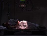 A patient lays on a therapeutic x-ray table at the 341st Medical Support Squadron radiology clinic Feb. 15, 2017, at Malmstrom Air Force Base, Mont. The radiology clinic is critical in producing the highest quality x-ray images to assist providers in accurately diagnosing a patient through the use of radiographs. (U.S. Air Force photo/Senior Airman Jaeda Tookes)