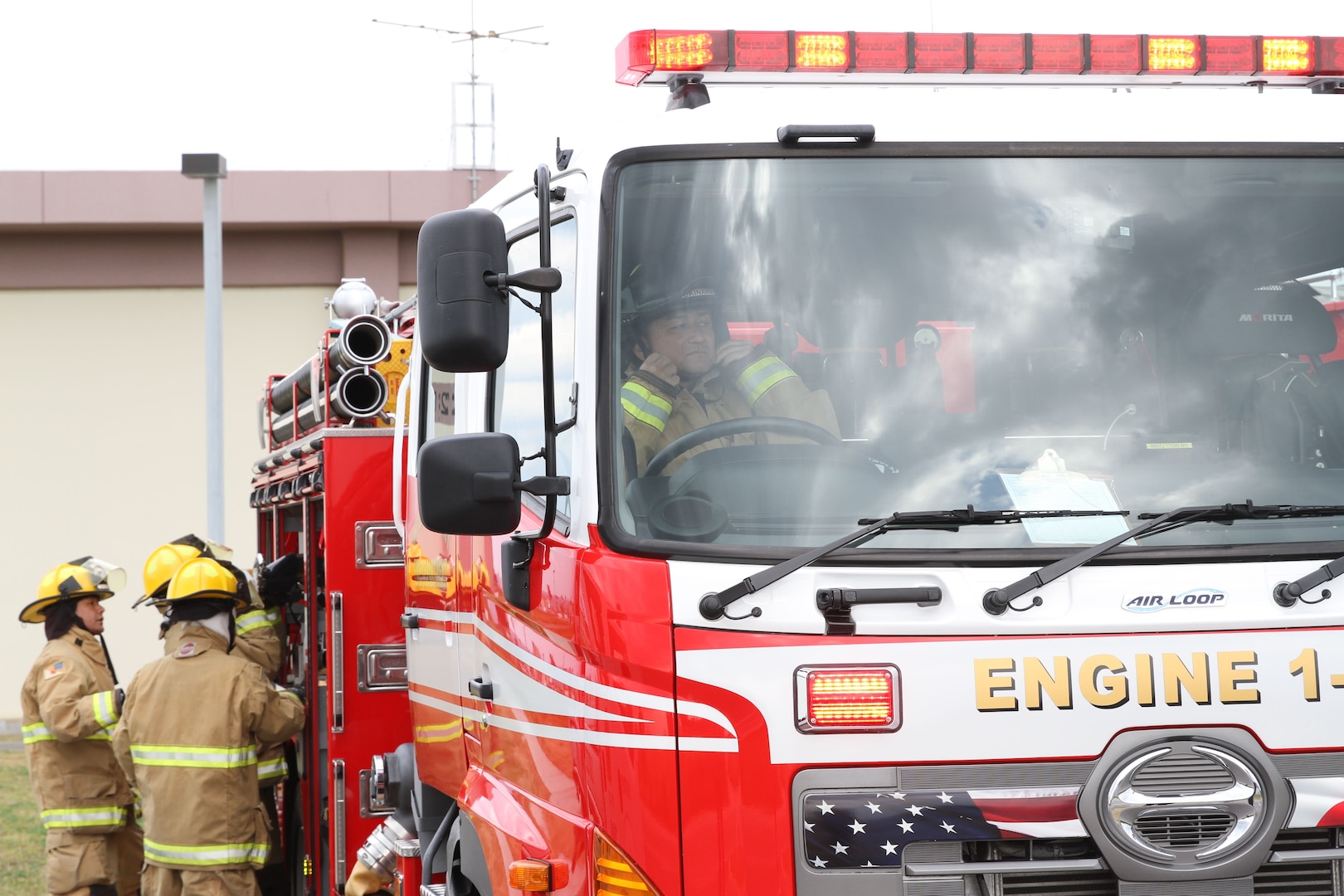 In this file photo, U.S. Army Garrison - Okinawa firefighters fine-tune their skills during an emergency drill. Teamwork is an integral part of success for the award winning fire department.