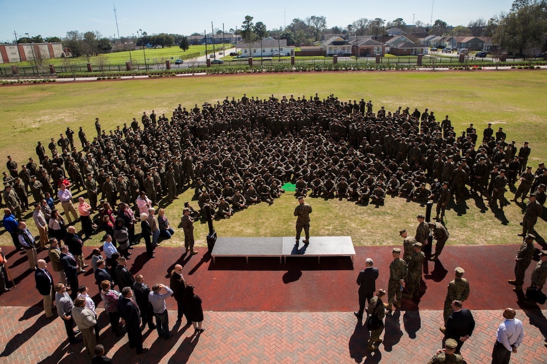 Commandant of the Marine Corps, Gen. Robert B. Neller (center), speaks to Marines from Marine Corps Support Facility New Orleans, Feb. 16, 2017. The CMC visited the Marines of Marine Forces Reserve and Marine Forces North to discuss his “Seize the Initiative” message. The message provides six resolutions for Marines to follow in 2017 to improve readiness so they will be ready and relevant to respond to future challenges. (U.S. Marine Corps photo by Cpl. Melissa Martens/ Released)