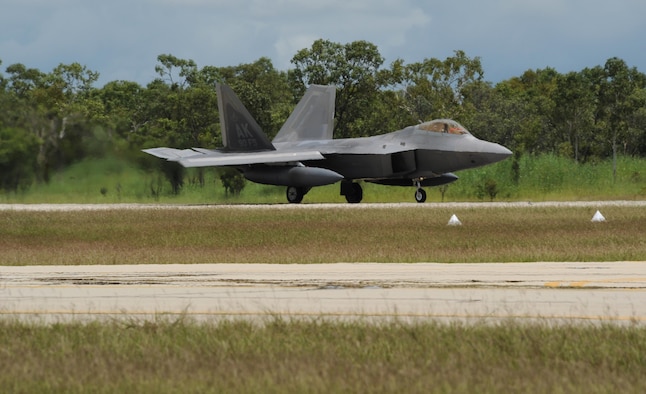 A U.S. Air Force F-22 Raptor assigned to the 90th Fighter Squadron, Joint Base Elmendorf-Richardson, Alaska, lands at Royal Australian Air Force (RAAF) Base Tindal, Feb. 13, 2017. Twelve F-22 Raptors and approximately 200 Airmen are at RAAF Base Tindal as part of the Enhanced Air Cooperation (EAC) Initiative under the Force Posture Agreement between the U.S. and Australia. EAC creates the foundation for an enhanced rotational presence of U.S. military personnel in Australia to promote interoperability, build upon our already strong alliance, and reaffirm our commitment to the Indo-Asia-Pacific region. (U.S. Air Force photo/Staff Sgt. Alexander Martinez)