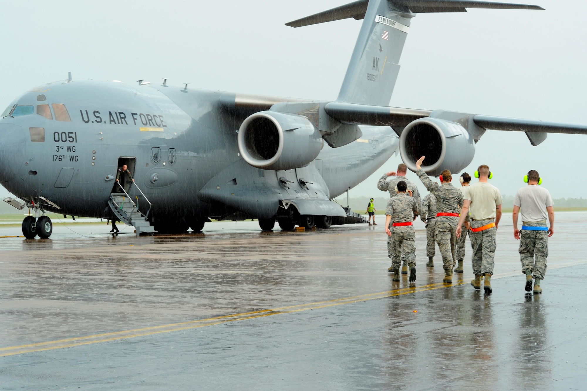 U.S. Airmen exit a C-17 Globemaster arriving from Joint Base Elmendorf-Richardson, Alaska, on the flightline at Royal Australian Air Force (RAAF) Base Tindal, Feb. 13, 2017. The Airmen arrived to support twelve F-22 Raptors, joining approximately 200 Airmen at RAAF Base Tindal as part of the Enhanced Air Cooperation (EAC) Initiative under the Force Posture Agreement between the U.S. and Australia. EAC creates the foundation for an enhanced rotational presence of U.S. military personnel in Australia to promote interoperability, build upon our already strong alliance, and reaffirm our commitment to the Indo-Asia-Pacific region.  (U.S. Air Force photo/Staff Sgt. Alexander Martinez)