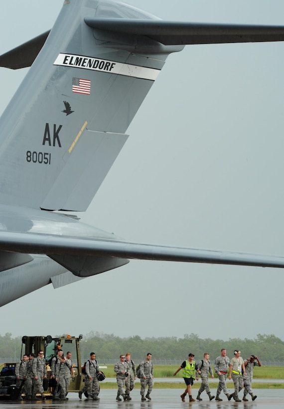U.S. Airmen arrive via a C-17 Globemaster assigned to Joint Base Elmendorf-Richardson, Alaska, on the flightline at Royal Australian Air Force (RAAF) Base Tindal, Feb. 13, 2017. The Airmen will support twelve F-22 Raptors, joining approximately 200 Airmen at RAAF Base Tindal as part of the Enhanced Air Cooperation (EAC) Initiative under the Force Posture Agreement between the U.S. and Australia. EAC creates the foundation for an enhanced rotational presence of U.S. military personnel in Australia to promote interoperability, build upon our already strong alliance, and reaffirm our commitment to the Indo-Asia-Pacific region.  (U.S. Air Force photo/Staff Sgt. Alexander Martinez)