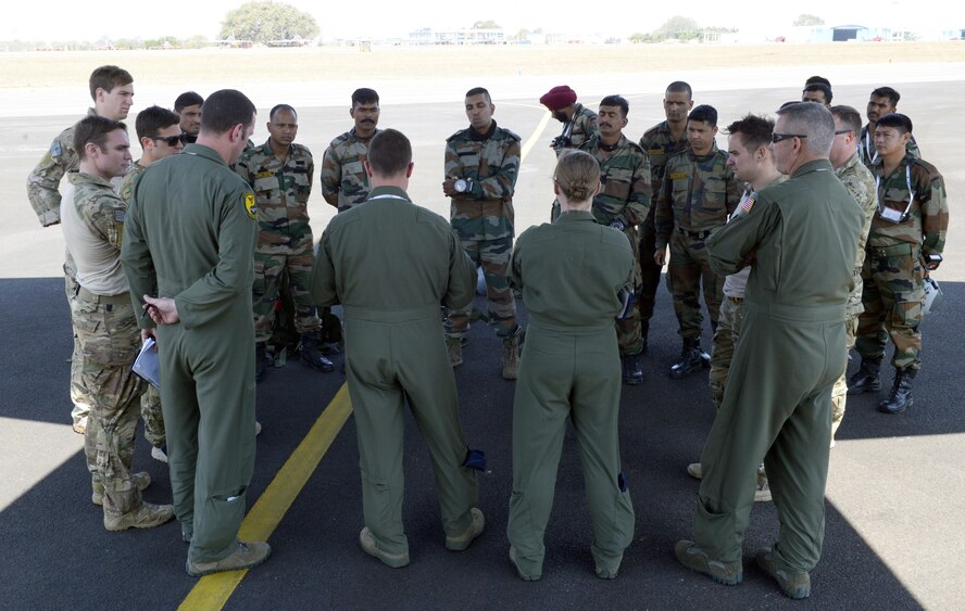 U.S. Air Force and Indian Army members receive a crew brief prior to boarding a C-130J Super Hercules assigned to the 143rd Airlift Wing, Rhode Island Air National Guard, for a joint free-fall jump during Aero India 2017 at Air Force Station Yelahanka, Bengaluru, India, Feb. 16, 2017. Jumpers from the two countries shared best practices and combined into jump teams, to the delight of the crowd. The U.S. participates in air shows and other regional events to demonstrate its commitment to the security of the Indo-Asia-Pacific region, promote the standardization and interoperability of equipment, and display capabilities critical to the success of current and future military operations. (U.S. Air Force photo by Capt. Mark Lazane)
