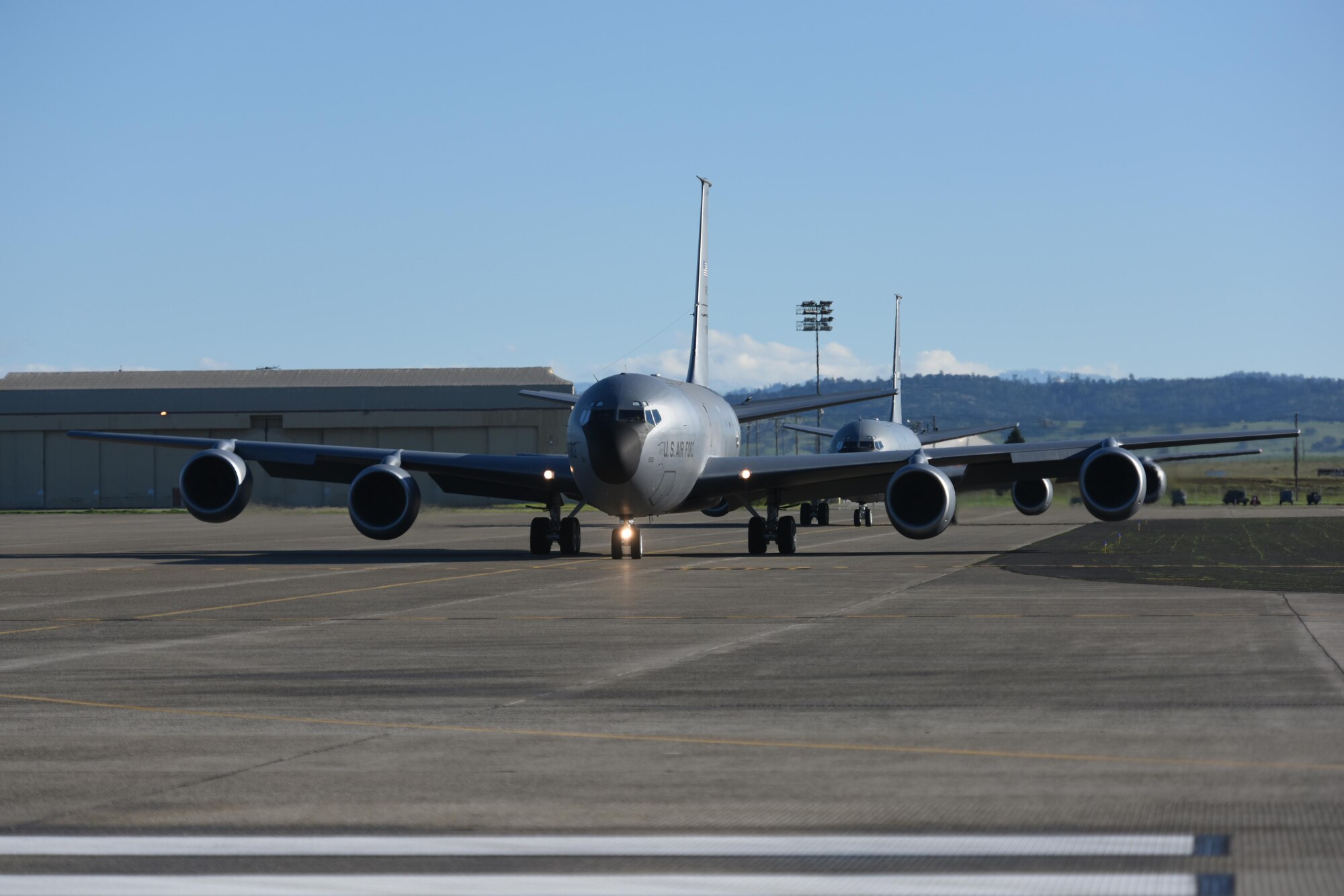 Two KC-135 Stratotankers from the 314th Air Refueling Squadron taxi down the runway during a unit training assembly at Beale Air Force Base, California on Feb. 11, 2017. The aircraft were preparing to take off as part of a two-ship aircraft formation training sortie early Saturday morning to refuel eight F-15 Eagles from the 173rd Fighter Wing stationed at Kingsley Field Air National Guard Base, Oregon. (U.S. Air Force photo by Staff Sgt. Brenda Davis).