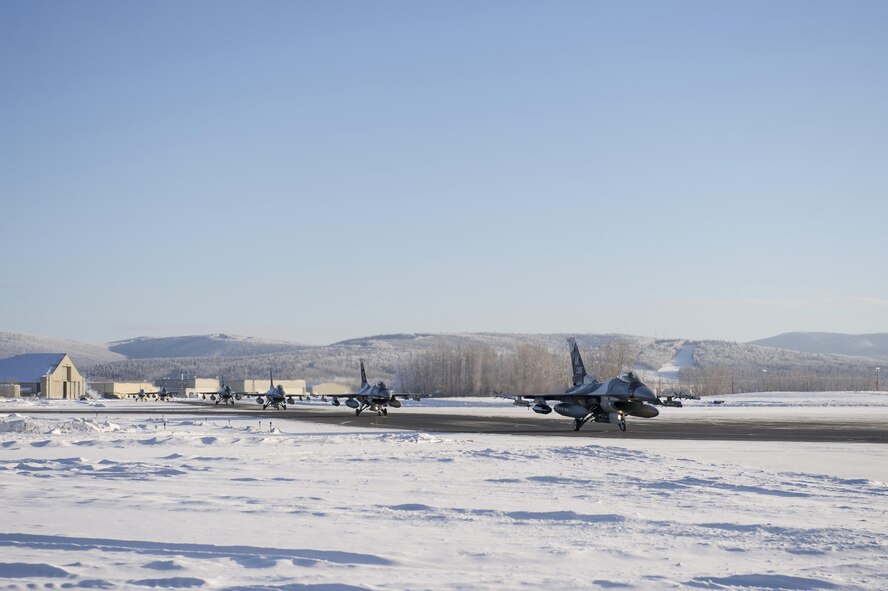 U.S. Air Force F-16 Fighting Falcon aircraft assigned to the 18th Aggressor Squadron, prepare to depart Feb. 12, 2017, from the Eielson Air Force Base, Alaska flight line. The aircraft deployed to Andersen Air Force Base, Guam, to play an adversary role during COPE NORTH 2017. (U.S. Air Force photo by Airman Isaac Johnson)