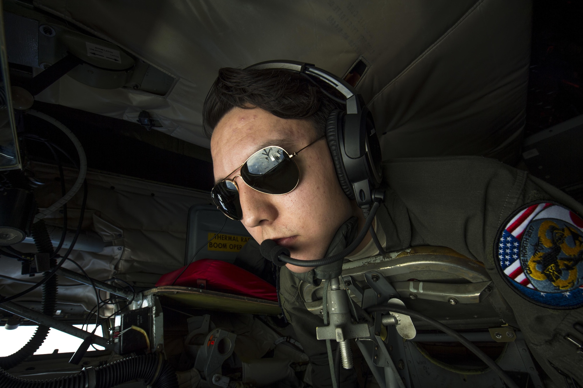 U.S. Air Force Airman 1st Class Luke Story, a 909th Air Refueling Squadron boom operator, operates a boom during an in-flight refueling of an F-15 Eagle during Cope North 2017, Feb. 16, 2017. The exercise includes 22 total flying units and more than 1,700 personnel from three countries and continues the growth of strong, interoperable relationships within the Indo-Asia-Pacific Region through integration of airborne and land-based command and control assets. (U.S. Air Force photo by Senior Airman Keith James)