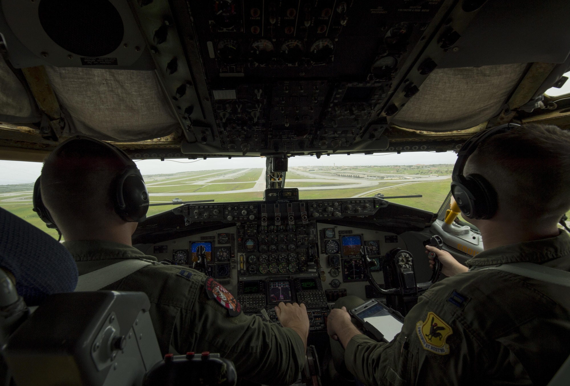 U.S. Air Force Capts. Ryan Nivan (left) and Ben Chase (right), 909th Air Fueling Squadron pilots, prepare to land a KC-135 Stratotanker on the flightline of Andersen Air Force Base, Guam after providing in-flight fuel to multiple aircraft during Cope North 2017, Feb. 16, 2017. The exercise includes 22 total flying units and more than 1,700 personnel from three countries and continues the growth of strong, interoperable relationships within the Indo-Asia-Pacific region through integration of airborne and land-based command and control assets. (U.S. Air Force photo by Senior Airman Keith James)