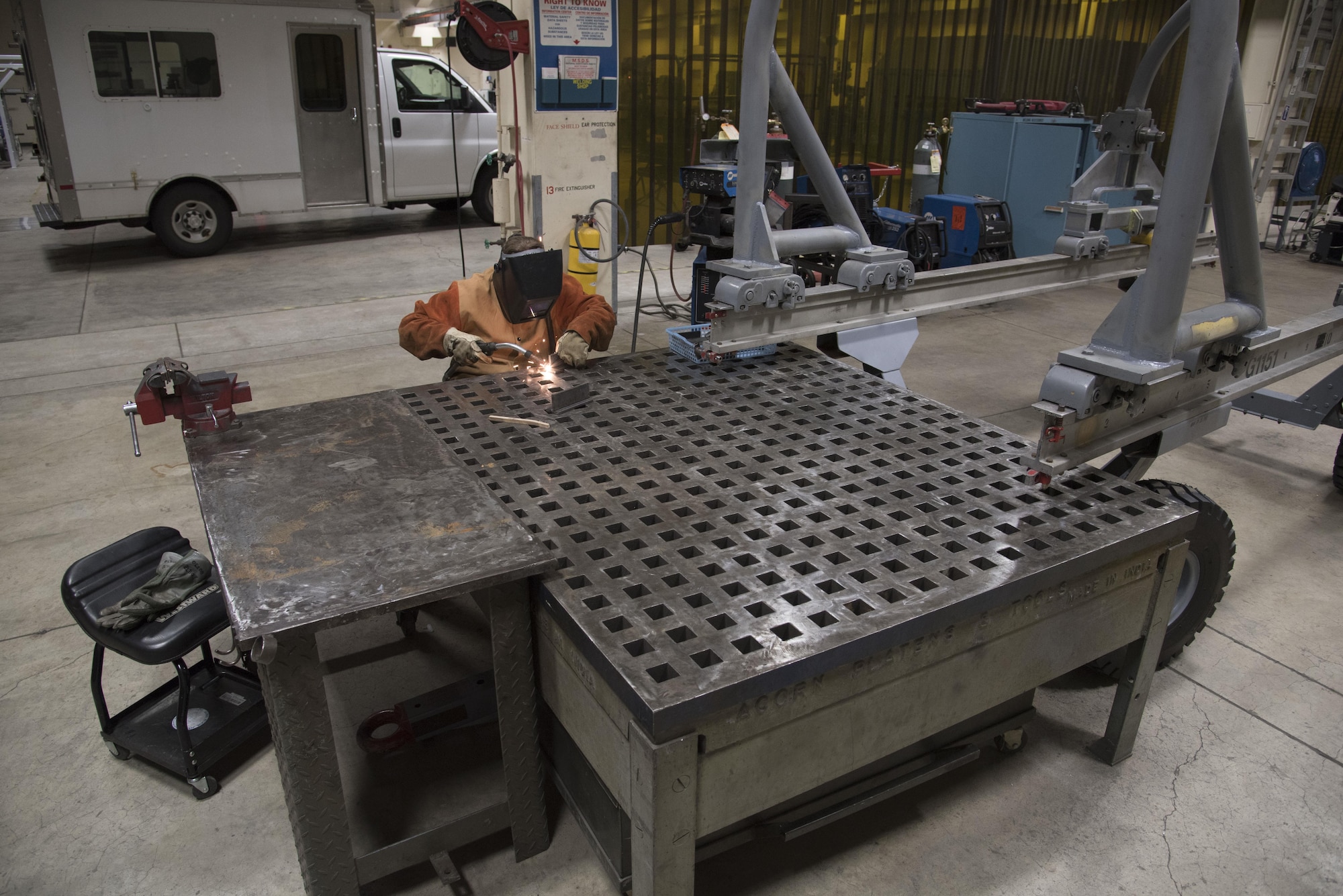 U.S. Air Force Airman 1st Class Elfie Diltz, a 35th Maintenance Squadron aircraft metals technology technician, welds on an acorn table at Misawa Air Base, Japan, Feb. 1, 2017. The table is made with a special coating to prevent hot metals from sticking to its surface and includes numerous slots for users to fasten parts while working. The shop makes the F-16 Fighting Falcon mission continue by providing fixes to aircraft parts. (U.S. Air Force photo by Airman 1st Class Sadie Colbert)