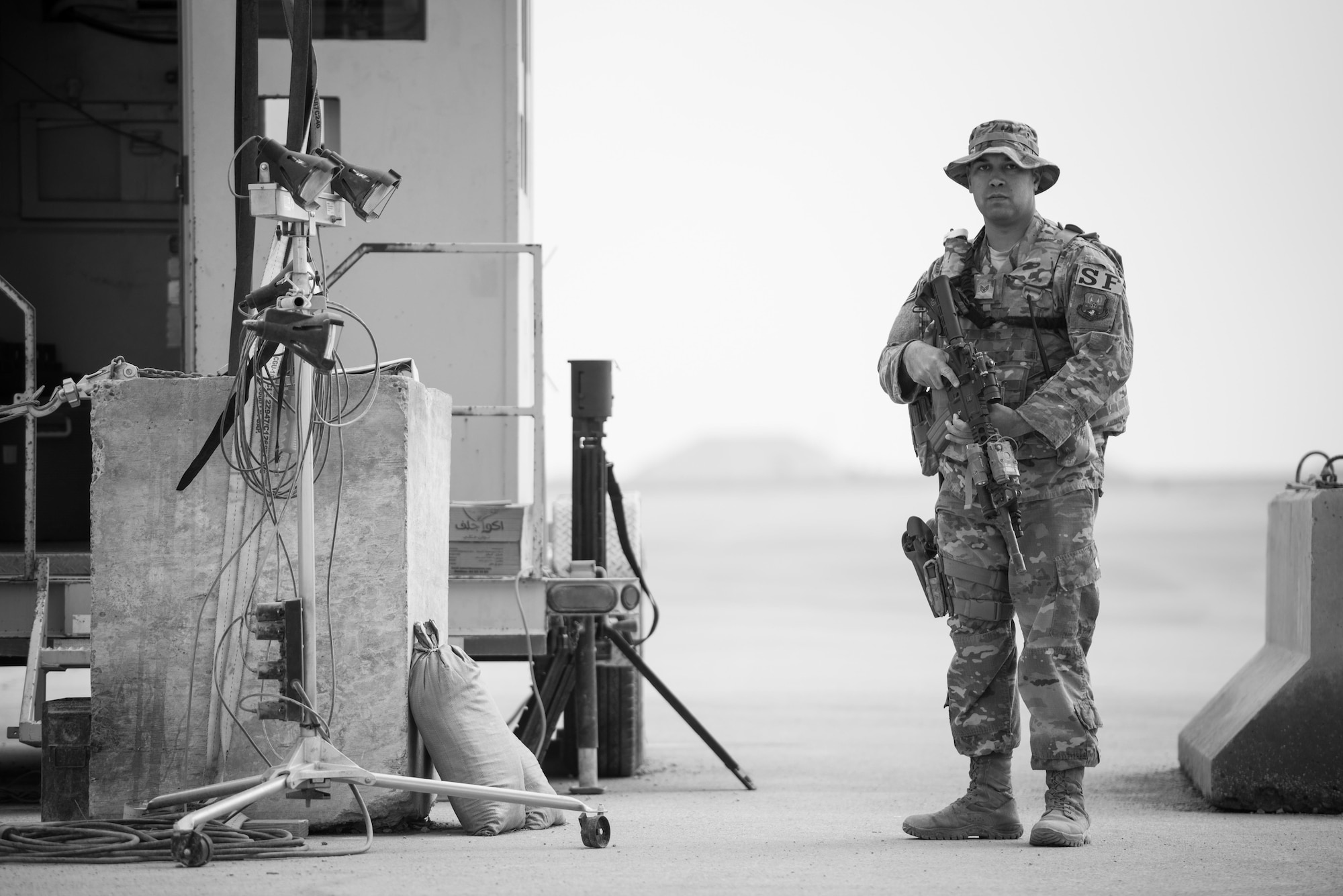 Staff Sgt. Christopher Pitts, 407th Expeditionary Security Forces Squadron, guards an entry control point at Al Asad Air Base, Iraq, Feb. 13, 2017. Pitts is forward deployed in support of Combined Joint Task Force - Operation Inherent Resolve. CJTF-OIR is the global Coalition to defeat ISIS in Iraq and Syria.(U.S. Air Force photo/Master Sgt. Benjamin Wilson)(Released)