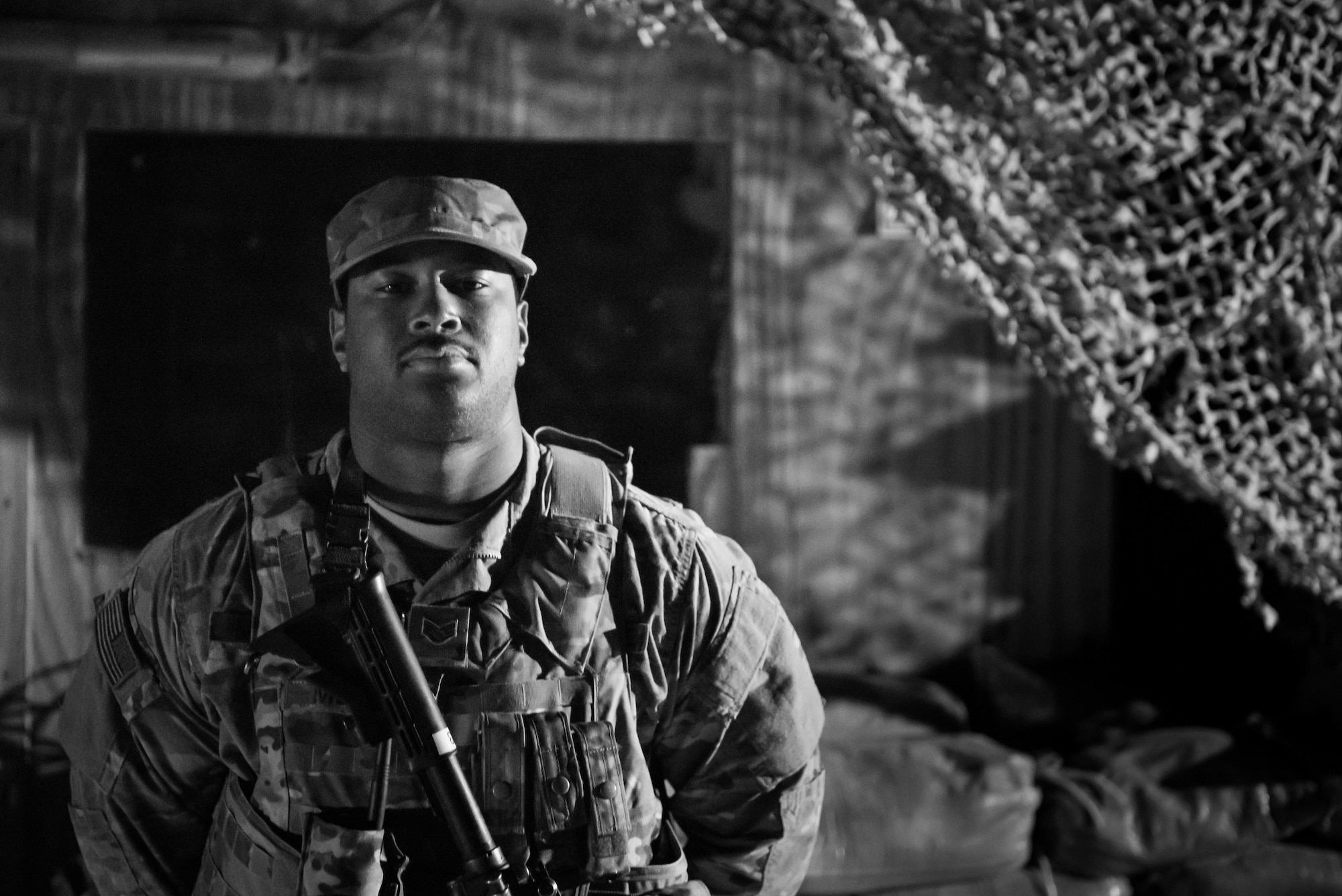 Staff Sgt. Antwan Menzie, Detachment 1 Security Forces, poses for a photo at an entry control point on Al Asad Air Base, Iraq, Feb. 13, 2017. Menzie is part of team, which includes 10 Airmen forward deployed from the 407th Air Expeditionary Group, which created restricted areas on the flightline of the base to protect U.S. Air Force assets.  (U.S. Air Force photo/Master Sgt. Benjamin Wilson)(Released)