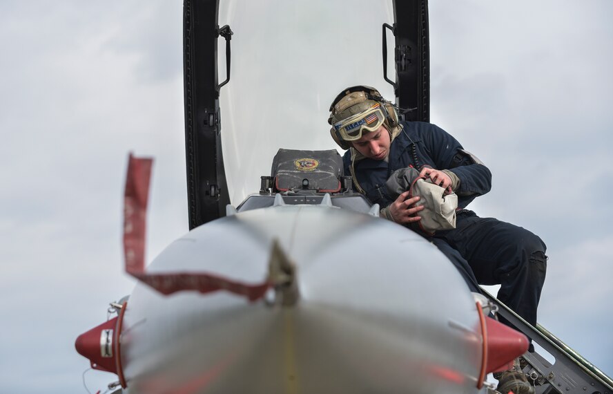 U.S. Air Force Senior Airman Jose Rosales, a dedicated crew chief with the 13th Fighter Squadron, inspects the cockpit of an F-16 Fighting Falcon at Misawa Air Base, Japan, Feb. 16, 2017. Rosales and other maintenance Airmen work 12-hour shifts while the 14th FS participates in COPE NORTH 17. Misawa Airmen upped the ante during a three-day surge last week, enhancing mission capabilities in case of a real-world scenario. (U.S. Air Force Photo by Staff Sgt. Melanie Hutto)