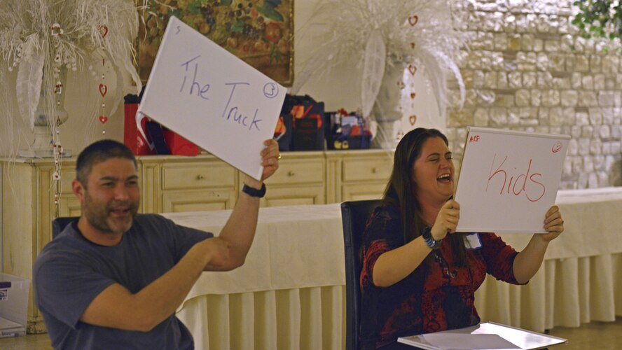 One couple answers the question, “Of all the things you’ve spent money on as a couple, what made you the happiest?” during a game at a “Forever For Real” event in Polcenigo, Italy, February 11, 2017. The event, hosted by the base chapel and Airman and Family Readiness Center, consisted of a five-course meal and an interactive discussion about finances. (U.S. Air Force photo by Senior Airman Cary Smith)