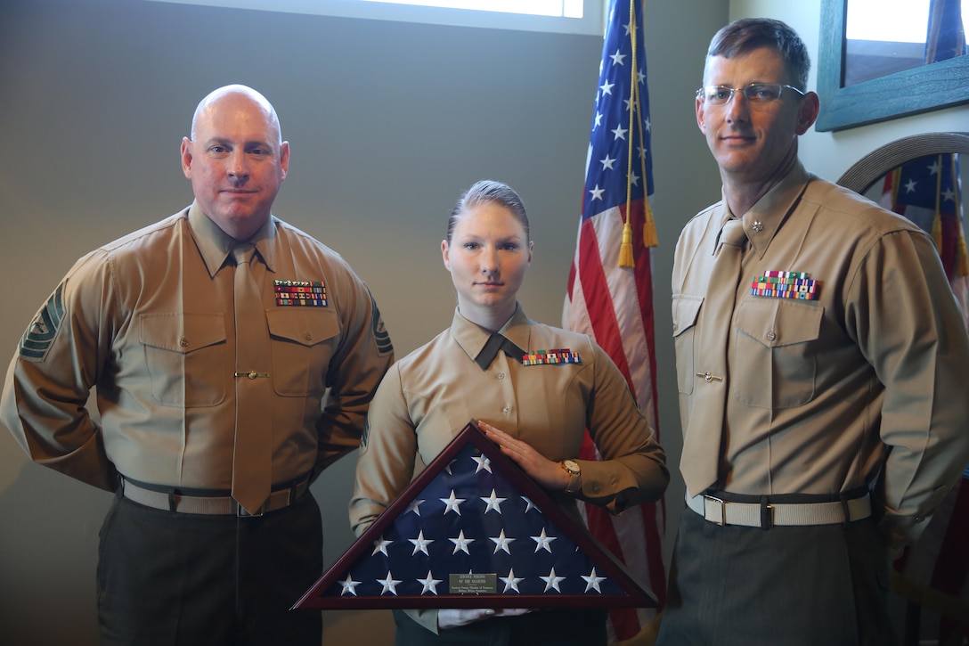Sgt. Alicia Hojara, center, was awarded the Carteret County Chamber of Commerce’s Service Person of the Quarter award during an honorary luncheon in Emerald Isle, N.C., Feb. 10, 2017. Master Sgt. Christopher McGuire, left, and Lt. Col. Garrett Randel, right, nominated Hojara for her outstanding dedication to giving back to the local community. Hojara volunteers for multiple organizations including the Tragedy Assistance Program for Survivors that provides comfort and care for families who have lost a family member in the armed services. Randel is the commanding officer and McGuire is the aviation ordnance chief of the Center for Naval Aviation Technical Training unit aboard Marine Corps Air Station Cherry Point. (U.S. Marine Corps photo by Lance Cpl. Cody Lemons/Released)