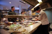 Airman 1st Class Samuel Abbott, 786th Force Support Squadron food service journeyman, serves Airmen during lunch at the Rheinland Dining Facility on Ramstein Air Base, Germany, Feb. 13, 2017. Last year, the 786th FSS supported more than 1,900 professional military education students and 1,200 essential station messing Airmen. (U.S. Air Force photo by Airman 1st Class Savannah L. Waters)