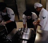Airman 1st Class Justin Newkirk(left), Airman 1st Class Samuel Abbott (middle), and Airman 1st Class Efrain Torres, all 786th Force Support Squadron food service journeymen, prepare lunch at the Rheinland Dining Facility on Ramstein Air Base, Germany, Feb. 13, 2017. The 786th FSS hosted the Food Service Shift Leader Course this past fall, training 13 Airmen and preparing them to lead their peers. (U.S. Air Force photo by Airman 1st Class Savannah L. Waters)
