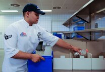 Airman 1st Class Joshua Figueroa, 786th Force Support Squadron food service journeyman, packs a Gatorade into a boxed meal at the Jawbone Flight Kitchen on Ramstein Air Base, Germany, Feb. 14, 2017. In 2016, the 786th FSS supported more than 4,000 sorties and over 500 medical evacuation flights out of the Jawbone Flight Kitchen. (U.S. Air Force photo by Airman 1st Class Savannah L. Waters)