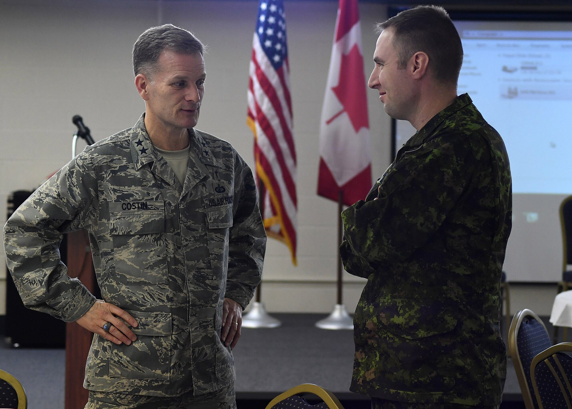 Maj. Gen. Dondi E. Costin, U.S Air Force Chief of Chaplains, left, speaks with Canadian armed forces member Capt. Jeff Reinink, 10th Space Warning Squadron crew commander, Feb. 16, 2017, on Cavalier Air Force Station, North Dakota. Costin became the first Air Force Chief of Chaplains to visit Cavalier AFS. (U.S. Air Force photo by Senior Airman Ryan Sparks)