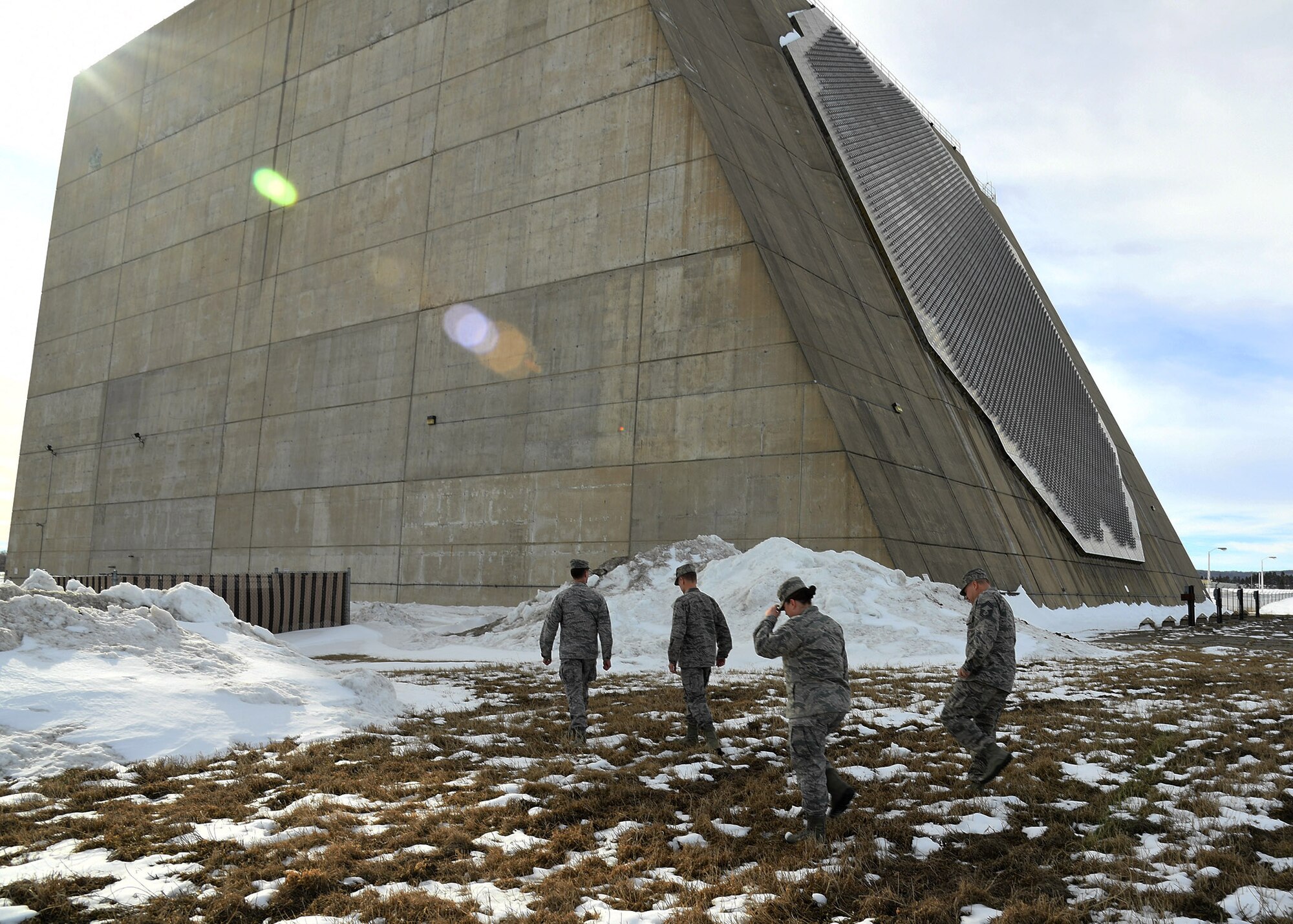 Maj. Gen. Dondi E. Costin, U.S. Air Force Chief of Chaplains, walks in front of the Perimeter Acquisition Radar Characterization System Feb. 16, 2017, on Cavalier Air Force Station, North Dakota. Costin met with Airmen stationed at Cavalier AFS and spoke with them about spiritual fitness. (U.S. Air Force photo by Senior Airman Ryan Sparks)