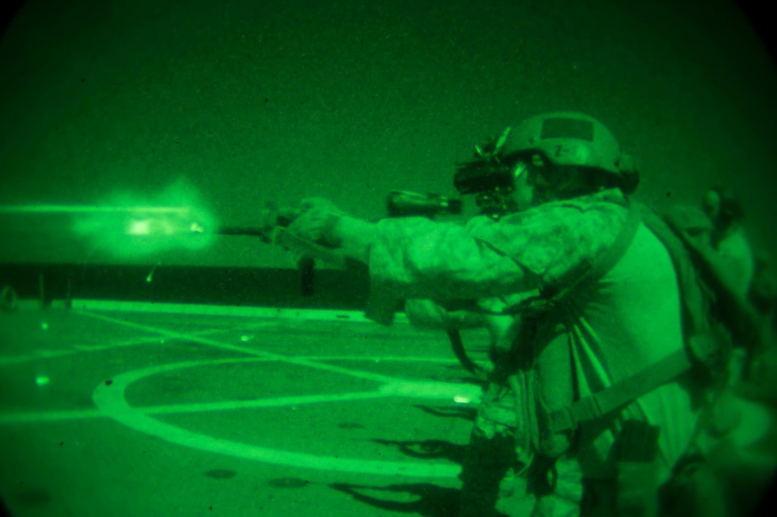 U.S. 5TH FLEET AREA OF OPERATION, USS Somerset (Feb. 10, 2017) U.S. Marines and Sailors with the Maritime Raid Force, 11th Marine Expeditionary unit, use infrared lasers to sight in on targets while conducting a live-fire shoot on the flight deck of the USS Somerset (LPD 25), Feb. 10. Infrared lasers are mounted on the Marines rifles and can be seen only through night vision optics. The 11th MEU is currently supporting U.S. 5th Fleet’s mission to promote and maintain stability and security in the region while underway during their West-Pac 16-2 deployment.