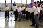 Civilian employees with the newly activated 12th maintenance Group activate the group's three squadrons during a ceremony Feb. 10 at Joint Base San Antonio-Randolph, Texas.  The group is the first civil service maintenance directorate in Air Education and Training Command to reorganize as a group.  (U.S. Air Force photo by Randy Martin) 