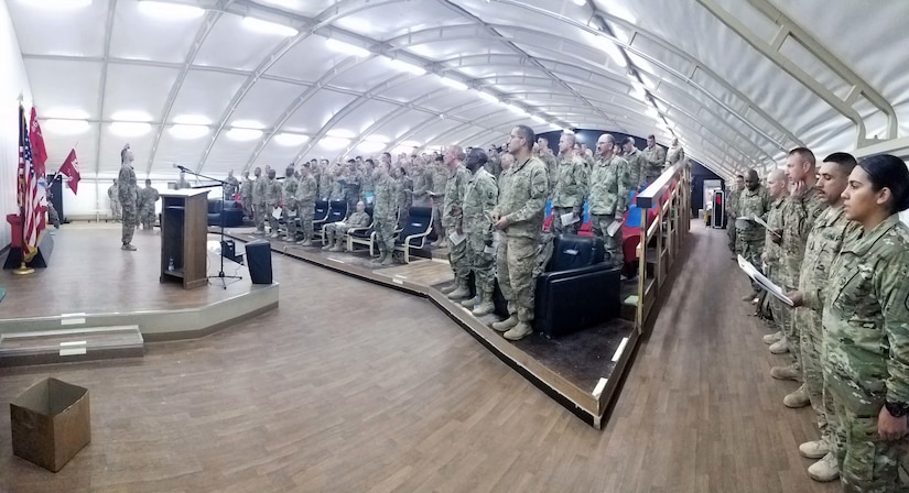 Approximately 100 Soldiers assigned to the 863rd Engineer Battalion participate in a Non-Commissioned Officer (NCO) Induction Ceremony, signifying the transition from enlisted to the rank of Sergeant at Camp Buerhing, Kuwait, Dec. 8, 2016.  (Photo by U.S. Army National Guard Capt. Maria Mengrone/Released)