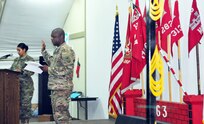 Senior Enlisted Advisor of the 863rd Engineer Battalion Command Sgt. Maj. Samuel E. Carr and native of Waukesha, Wis., administers the Non-Commissioned Officer oath to the 100 Soldiers participating in the NCO Induction Ceremony, which signifies the transition from enlisted to the rank of Sergeant at Camp Buerhing, Kuwait, Dec. 8, 2016.  (Photo by U.S. Army National Guard Capt. Maria Mengrone/Released)