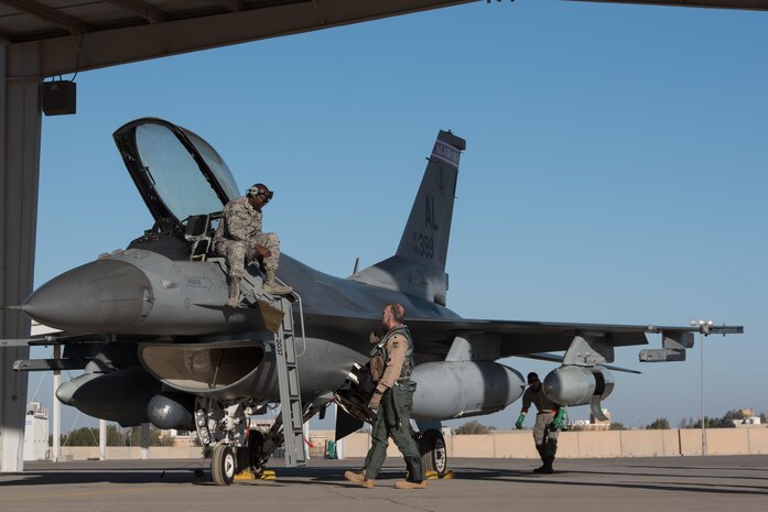 An F-16 from the Alabama Air National Guard arrives at the 407th Air Expeditionary Group where it is assigned to the 134th Expeditionary Fighter Squadron in support of Operation Inherent Resolve Dec. 10, 2016. The red tail flash of the jet brings the Tuskegee Airmen’s legacy back the 332nd Air Expeditionary Wing, to which the 134th EFS is currently assigned.  (U.S. Air Force photo/Master Sgt. Benjamin Wilson)(Released)