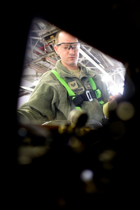 Staff Sgt. Jonathan Cunningham, of the 121st Air Refueling Wing, covers the windows in preparation for painting on a KC-135 Stratotanker February 15, 2017 at Rickenbacker Air National Guard Base. The aircraft had just returned from receiving depot level maintenance at Tinker Air Force Base, Oklahoma. (U.S. Air National Guard photo by Senior Master Sgt. Ralph Branson)