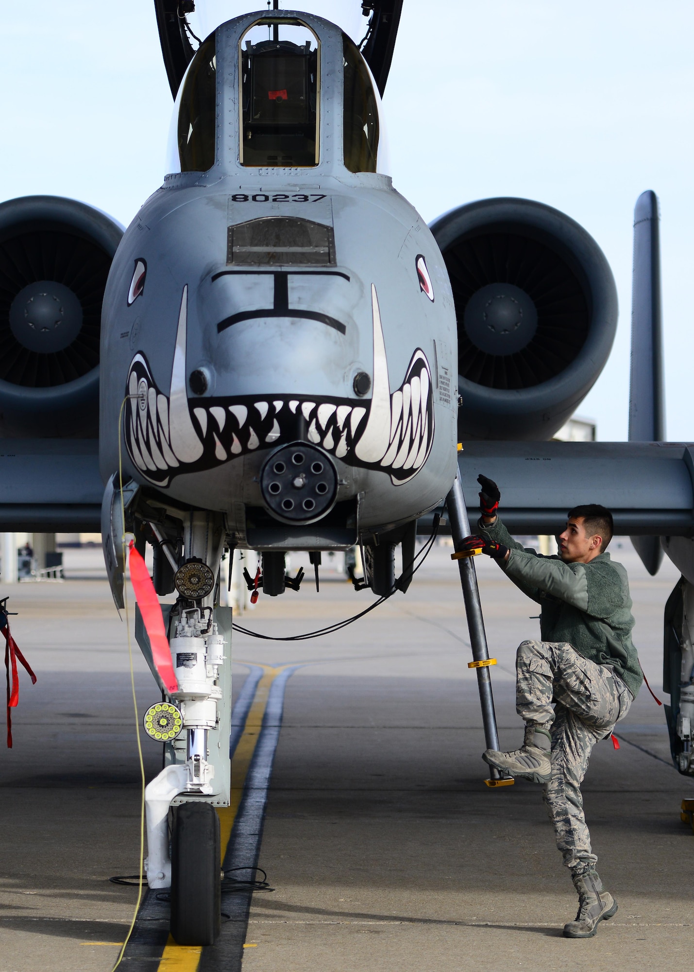 U.S. Air Force Senior Airman Alonso Gudino, a crew chief assigned to the 358th Fighter Squadron, climbs up an A-10 Thunderbolt II aircraft during pre-flight checks prior to a local flying mission at Whiteman Air Force Base, Mo., Feb. 14, 2017. The Thunderbolt II can employ a wide variety of conventional munitions, including general purpose bombs, cluster bomb units, laser guided bombs, joint direct attack munitions (JDAM), wind corrected munitions dispenser (WCMD), AGM-65 Maverick and AIM-9 Sidewinder missiles, rockets, illumination flares, and the GAU-8/A 30mm cannon, capable of firing 3,900 rounds per minute to defeat a wide variety of targets including tanks.