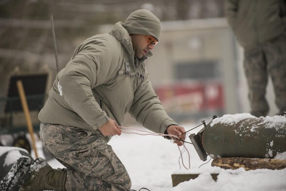 Senior Airman Rineck Darnellmartin, with the 158th Fighter Wing Explosive Ordnance Disposal Unit, practices and deploys techniques used to safely diffuse munitions during a controlled training session in Vermont Feb. 11, 2017. (U.S. Air National Guard Photo/Senior Airman Jon Alderman)