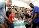 Children with special needs, their siblings and parents, and volunteers make homemade snow during a STEM event Feb. 15, 2016 at the Hill Air Force Base, Utah. The event, coordinated by the base library and Exceptional Family Member Program-Family Support Specialist, featured visual- and texture-based activities. (U.S. Air Force photo by Todd Cromar)