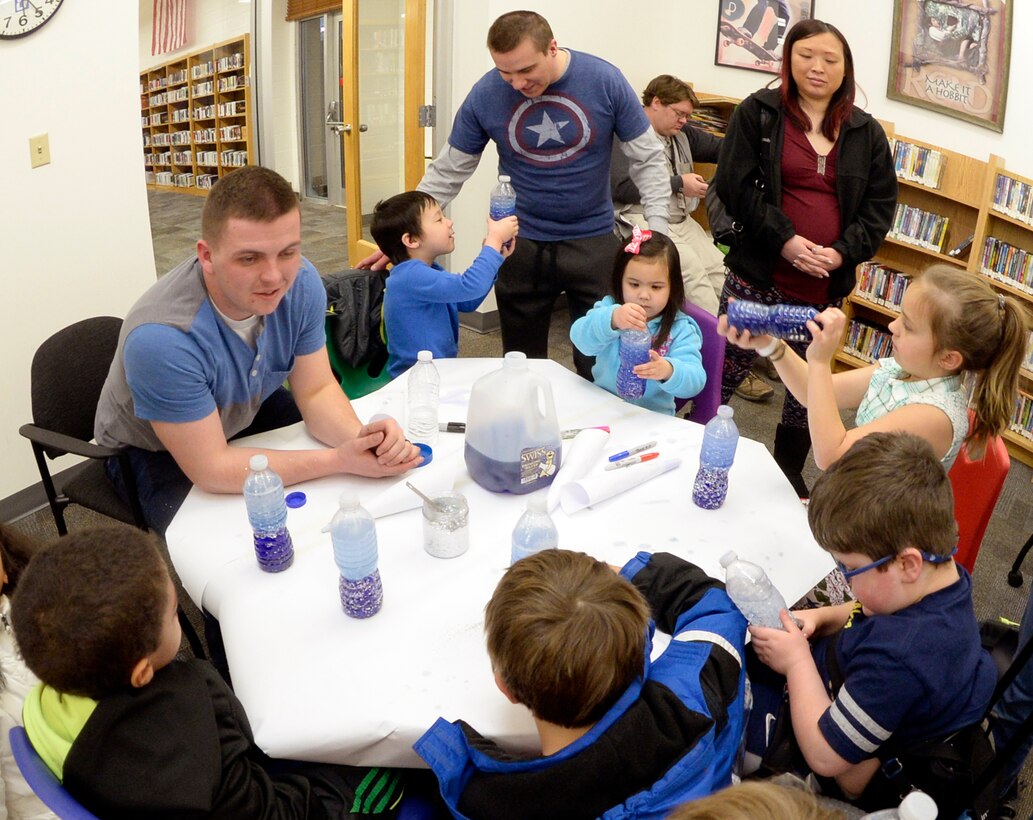 Children with special needs, their siblings and parents, and volunteers make anti-gravity galaxies in bottles during a STEM event Feb. 15, 2016 at the Hill Air Force Base, Utah. The library conducts STEM events most months of the year, generally every third Wednesday. For information on library programs, call 801-777-2533. (U.S. Air Force photo by Todd Cromar)