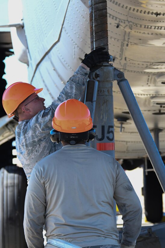 A giant jack is placed in position on a B-52 Stratofortress during a bag lift exercise at Barksdale Air Force Base, La., Feb. 16, 2017. Supporting the tail of the jet was critical to ensure safety during the exercise. Bag lifts are performed on aircraft rendered immobile due to faulty landing gear. This was the first such exercise attempted with a B-52 since 1984. (U.S. Air Force photo by Tech. Sgt. Ted Daigle/Released)