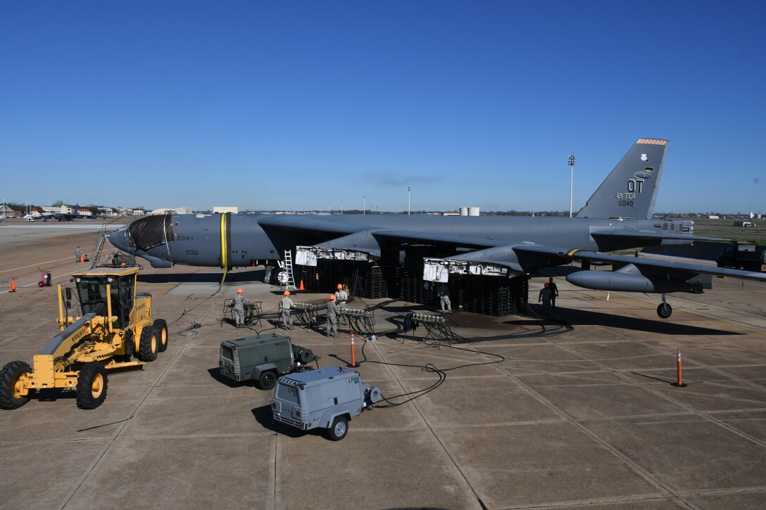 A B-52 Stratofortress undergoes a bag lift exercise at Barksdale Air Force Base, La., Feb. 16, 2017. A pneumatic lifting bag raises an aircraft that has experienced a landing gear failure or from terrain where it is impractical or impossible to use standard aircraft jacks. Air Force Global Strike Command, 2nd Bomb Wing, 307th Bomb Wing and Sheppard Air Force base combined their efforts to lift a B-52 that was damaged in a fire more than two years ago. This raise has not been attempted since 1984. (U.S. Air Force photo by Tech. Sgt. Ted Daigle/Released)