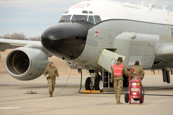 Royal Air Force 51 Squadron maintenance personnel recover an RAF RC-135 Airseeker following its landing at Offutt Air Force Base, Neb. Feb. 11. The aircraft diverted from Nellis Air Force Base to Offutt where it received maintenance assistance from the 55th Maintenance Group to correct a landing gear problem that occurred while participating in a joint exercise. (U.S. Air Force photo by Delanie Stafford)