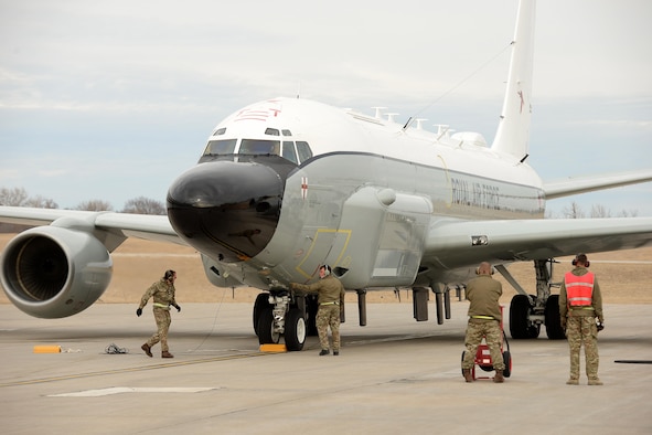 Royal Air Force 51 Squadron maintenance personnel recover an RAF RC-135 Airseeker following its landing at Offutt Air Force Base, Neb. Feb. 11. The aircraft diverted from Nellis Air Force Base to Offutt where it received maintenance assistance from the 55th Maintenance Group to correct a landing gear problem that occurred while participating in a joint exercise. (U.S. Air Force photo by Delanie Stafford)
