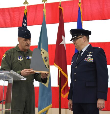 ARMY AVIATION SUPPORT FACILITY, Del.-  Col. Robert Culcasi,commander, 166th Airlift Wing presents a tailflash from the 166th Airlift Wing to Col. David B. Walker for his dedication and service as Vice Commander of the 166th Airlift Wing. Walker assumed command in the position of  Delaware National Guard Adjutant General- Air on Feb. 11, 2016. (U.S. Air National Guard photo by Tech. Sgt. Gwendolyn Blakley/ Released).